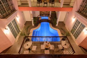 an overhead view of a swimming pool in a building at Hotel Boutique Real San Juan Center in Mérida