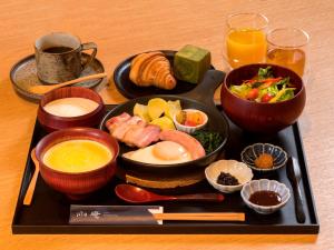 a tray of food with a plate of breakfast foods at UAN kanazawa in Kanazawa