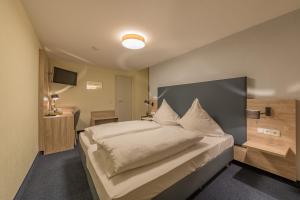 Postel nebo postele na pokoji v ubytování Hotel Windsor