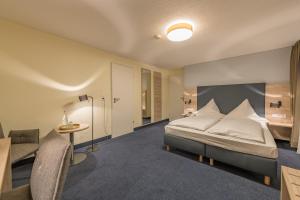 Postel nebo postele na pokoji v ubytování Hotel Windsor