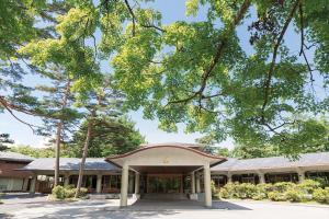 an office building with a tree in front of it at Karuizawa Prince Hotel East in Karuizawa +57 photos