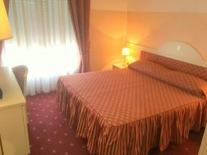 Postel nebo postele na pokoji v ubytování Hotel Internazionale Gorizia