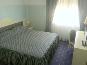 Postel nebo postele na pokoji v ubytování Hotel Internazionale Gorizia