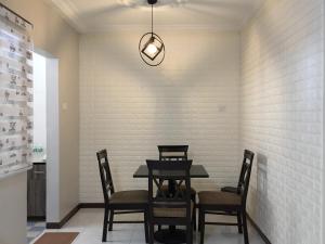 a dining room with a table and chairs at D’Savoy @ Famosa by SH in Melaka