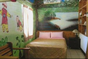 Ένα ή περισσότερα κρεβάτια σε δωμάτιο στο Sea Villa Homestay