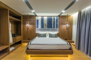 Ein Bett oder Betten in einem Zimmer der Unterkunft Stay with Nimman Chiang Mai - SHA Extra Plus