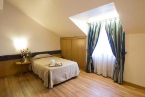 Voodi või voodid majutusasutuse Albert Hotel toas