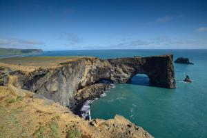 a large cave in the middle of the ocean at Hótel Kría in Vík
