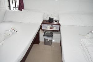 Un pat sau paturi într-o cameră la Om Guest House