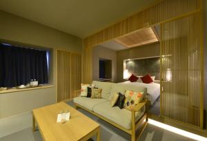 Postel nebo postele na pokoji v ubytování Roppongi Hotel S