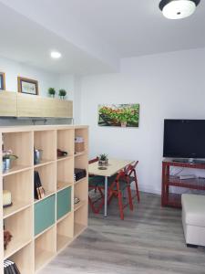 TV a/nebo společenská místnost v ubytování Casa Aguilas