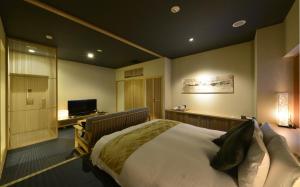 Postel nebo postele na pokoji v ubytování Roppongi Hotel S
