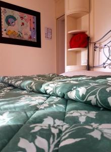Giường trong phòng chung tại Piccolo Mondo