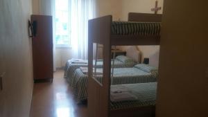 Ostello Villa Monte Mario客房内的一张或多张床位