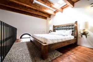 a bedroom with a large bed with a wooden headboard at Faro Capo Spartivento in Chia