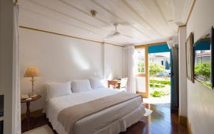 Cama ou camas em um quarto em Hotel Solar do Rosário