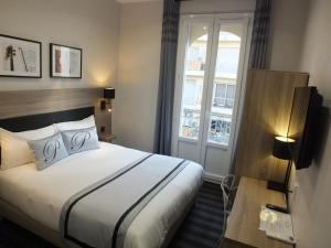 Postel nebo postele na pokoji v ubytování Hotel Paganini