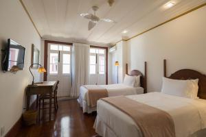 Cama ou camas em um quarto em Hotel Solar do Rosário