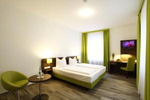 Postel nebo postele na pokoji v ubytování Arthotel ANA Eden