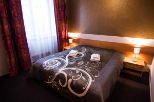 Postel nebo postele na pokoji v ubytování Hotel Hron
