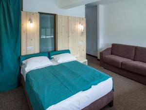 Postel nebo postele na pokoji v ubytování Complex Hotelier COTA O MIE