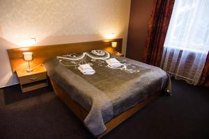 Postel nebo postele na pokoji v ubytování Hotel Hron