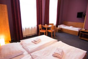 Postel nebo postele na pokoji v ubytování Hotel Hron