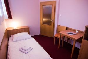 Postel nebo postele na pokoji v ubytování Hotel Hron