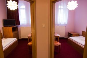 Postel nebo postele na pokoji v ubytování Hotel Hron