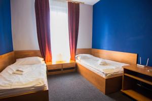 Postel nebo postele na pokoji v ubytování Hotel Hron
