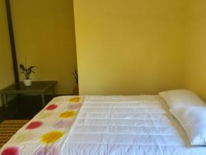 A bed or beds in a room at Bunyong Homestay