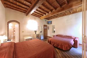 Postel nebo postele na pokoji v ubytování Hotel Villa San Michele