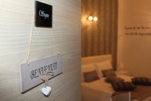 A bed or beds in a room at Residence Emozioni Ortigia