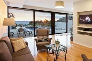 a living room with a couch and a glass table at Villa Sima in Makarska