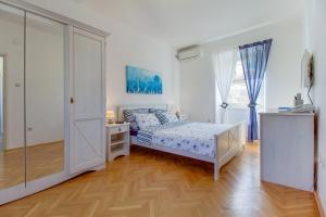 Postel nebo postele na pokoji v ubytování Hotel Sansegus