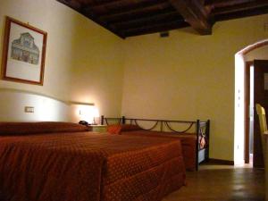 Postel nebo postele na pokoji v ubytování Hotel Villa San Michele