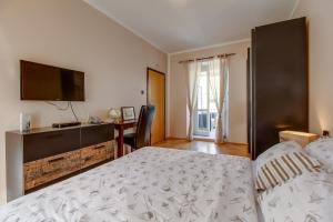 Postel nebo postele na pokoji v ubytování Hotel Sansegus