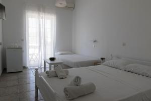 Postel nebo postele na pokoji v ubytování Armadoros Hotel / Ios Backpackers