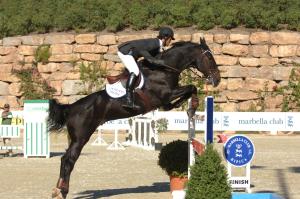 a person jumping a horse over a fence at Marbella Club Hotel · Golf Resort & Spa in Marbella