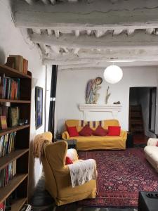 a living room with two couches and a fireplace at Casa Barbara in Ferreirola