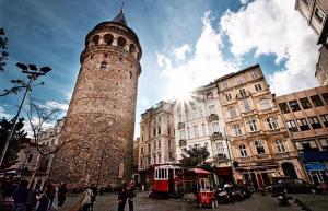 a tall tower in the middle of a city at Vita Suites Karaköy in Istanbul