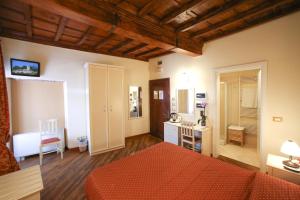 Postel nebo postele na pokoji v ubytování Hotel Villa San Michele