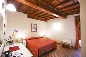 Postel nebo postele na pokoji v ubytování Hotel Villa San Michele