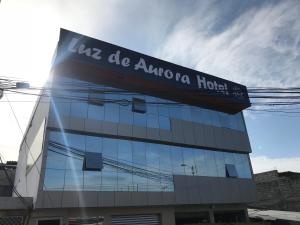 a building with a sign that reads us de akoya hospital at Luz de Aurora HOTEL in Manta
