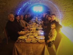 a group of people sitting at a long table at Akbulut Konak in Safranbolu