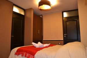 Katil atau katil-katil dalam bilik di Hotel Royal Qosqo