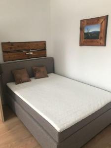 a bed in the corner of a room at Bergsuite NO.27 in Braunlage
