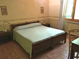 Cama o camas de una habitación en Agriturismo Cascina degli Ulivi