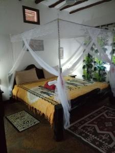 Uma cama ou camas num quarto em Villa Fortuna Malindi