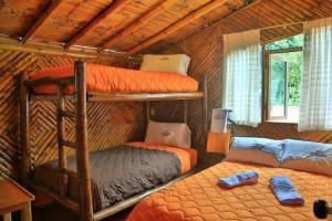 Postel nebo postele na pokoji v ubytování La Posada de Mindo